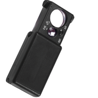 Una lente d'ingrandimento fuori dalla sua custodia con LED, ingrandimento 10x e 30x, nero.